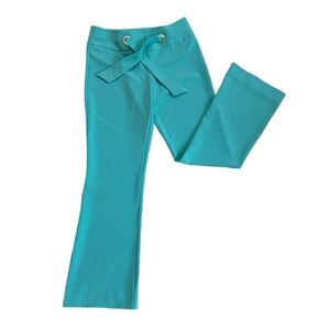 CACHE ~ Turquoise Flared Pants with Bow Strap Detail and Silver Toned Grommets